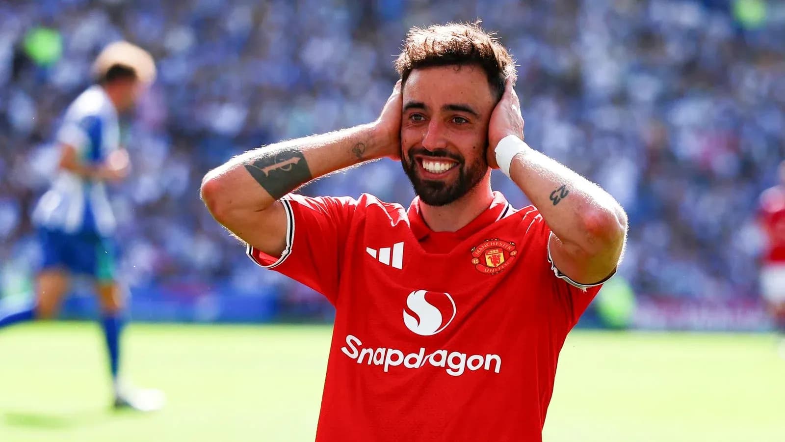 Bruno Fernandes celebrating a goal with hands on head