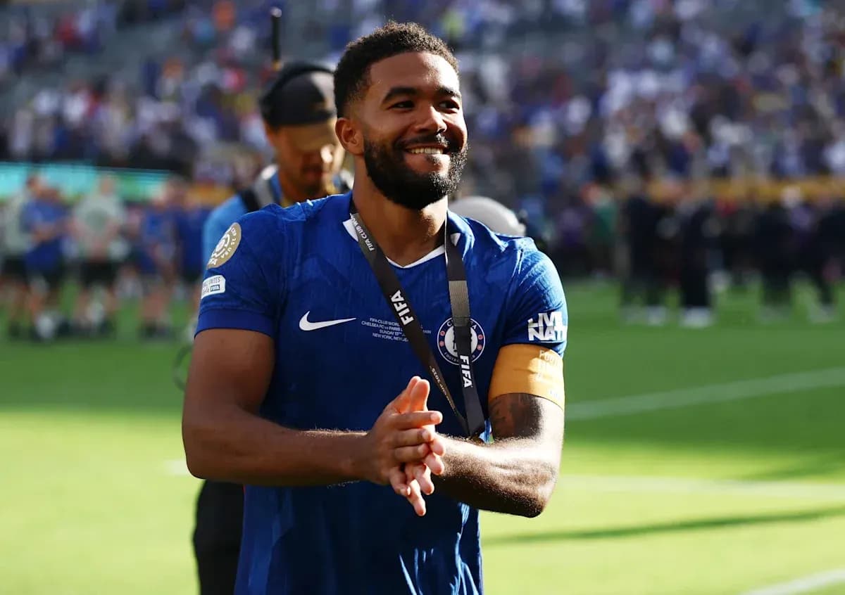 Player celebrating with medal on the field