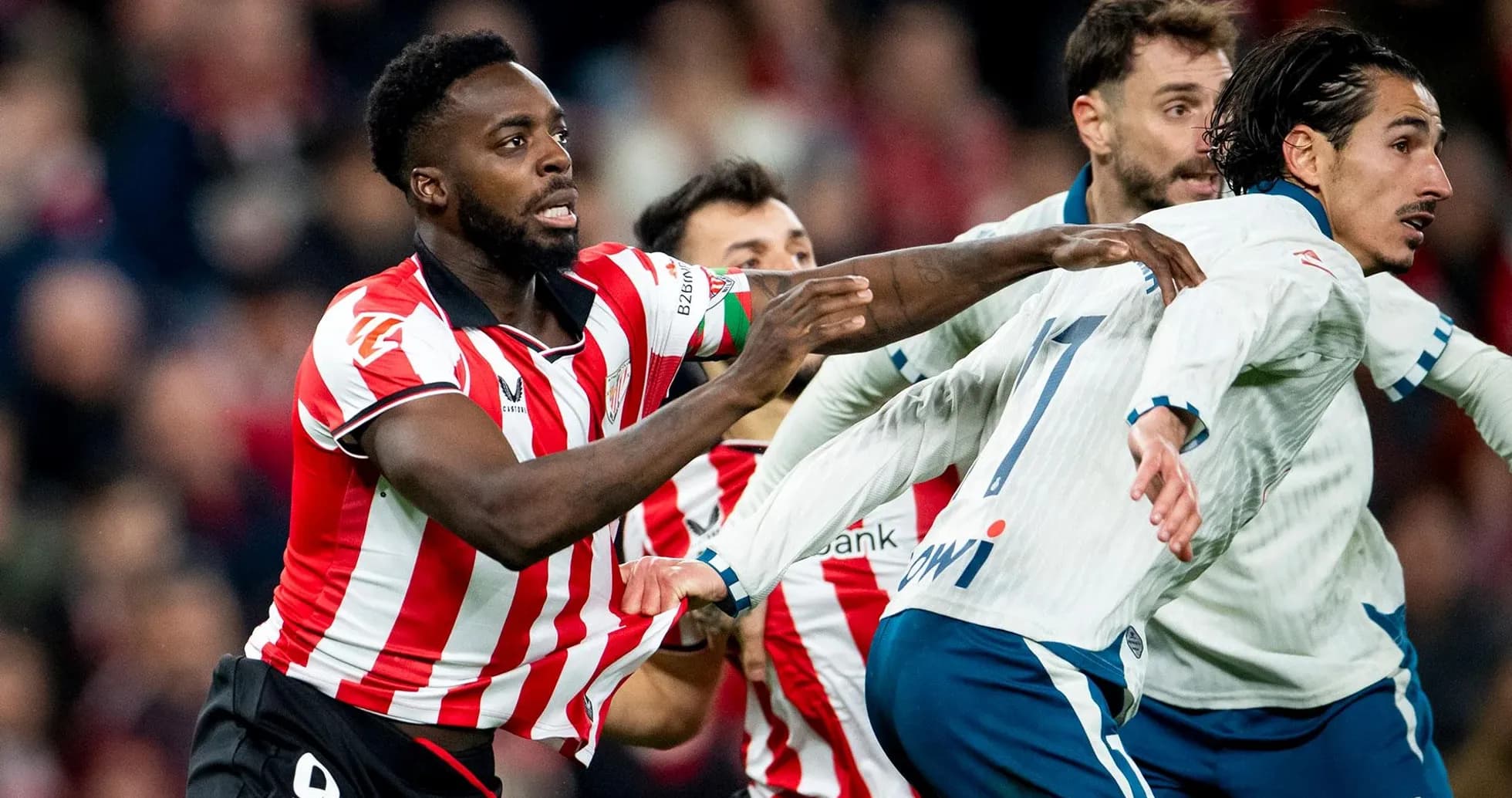 Athletic Club players competing for the ball