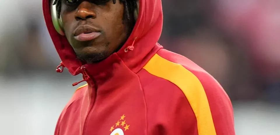 Player in Galatasaray hoodie during match warm-up