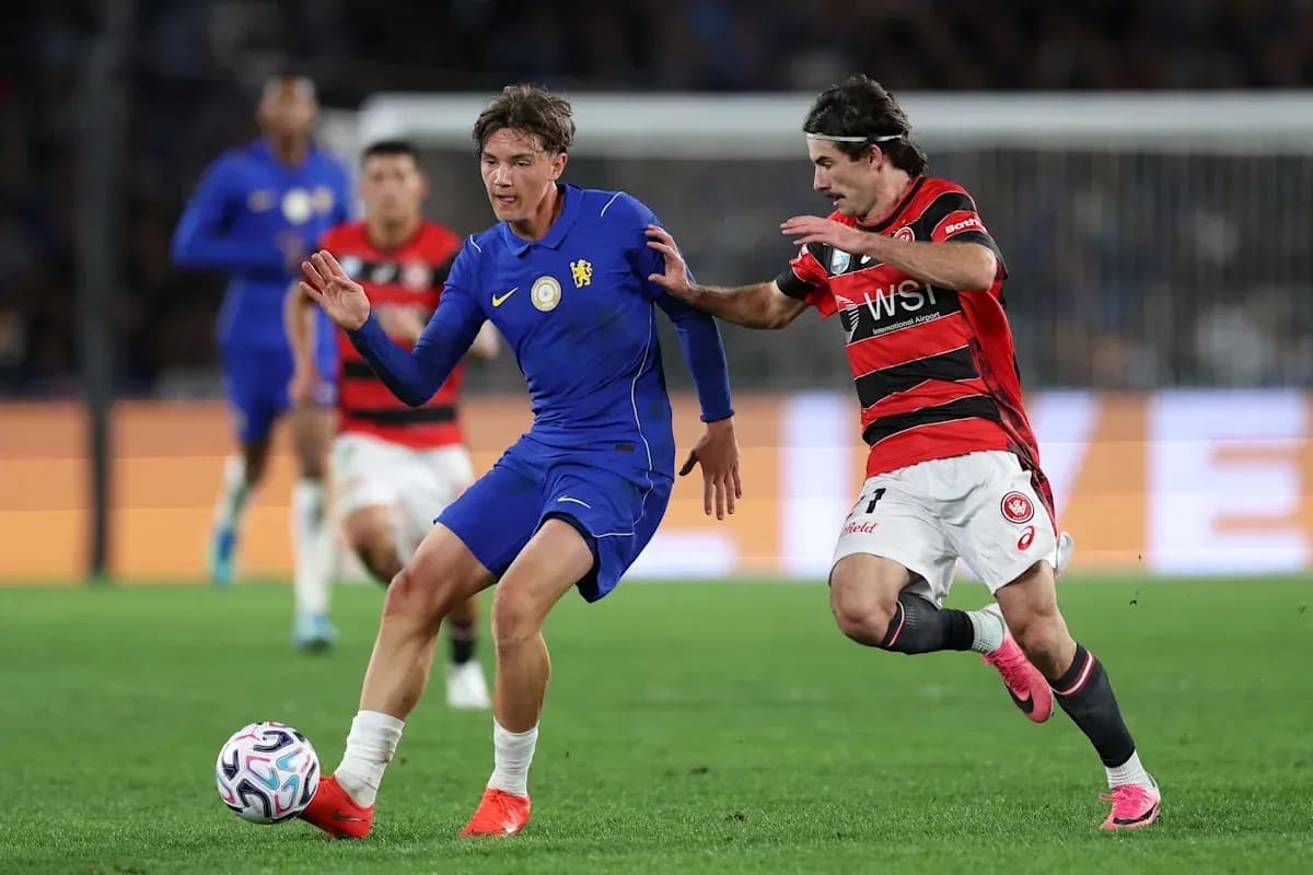 Player in blue evading opponent in red during match