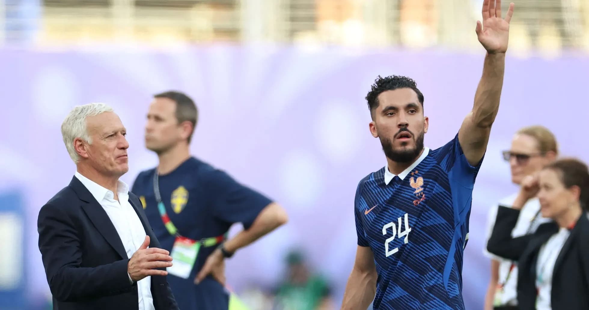 France coach and player during match warm-up