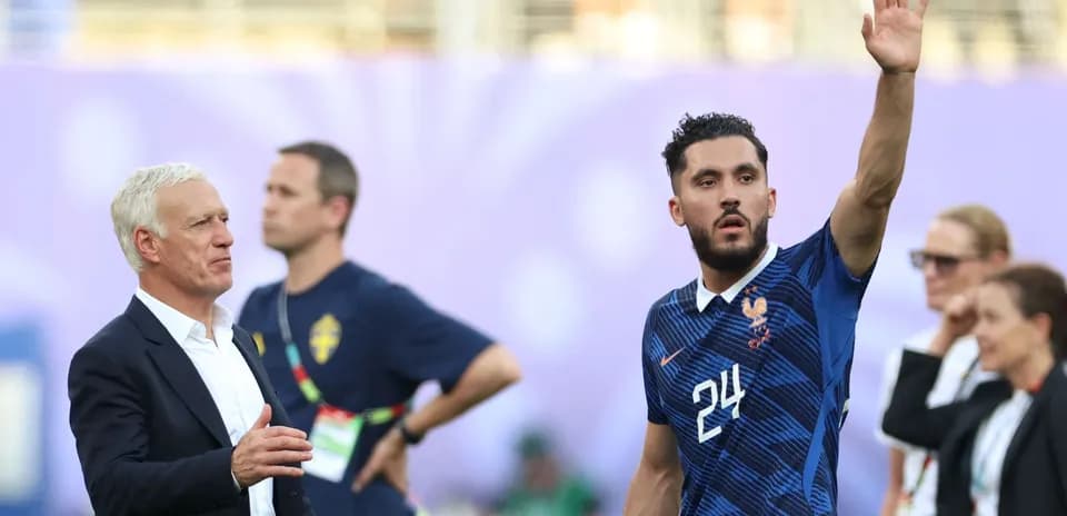 France coach and player during match warm-up
