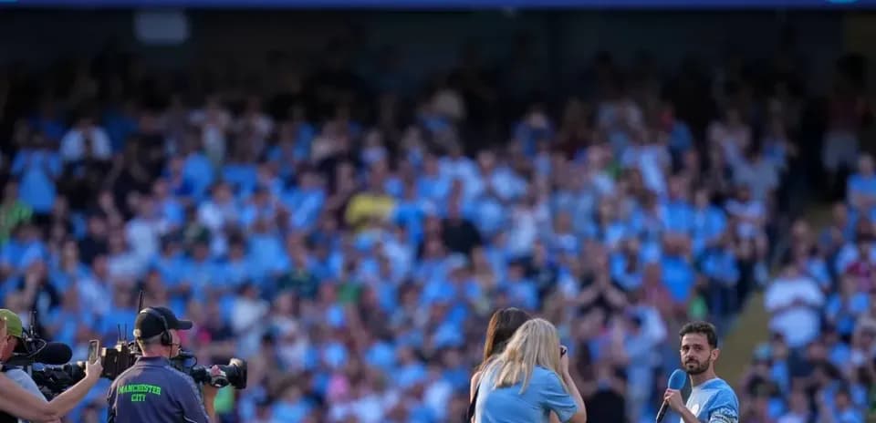 Player addressing fans during farewell event at stadium