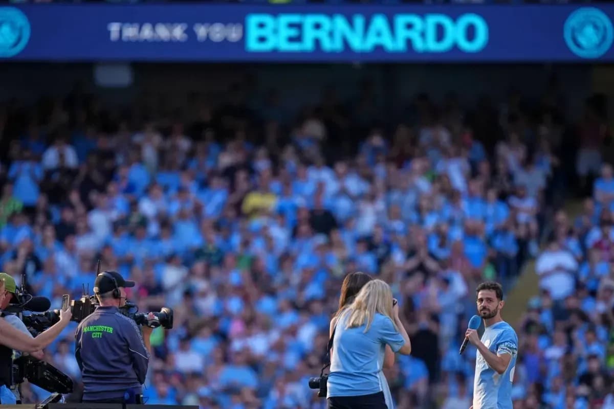 Player addressing fans during farewell event at stadium