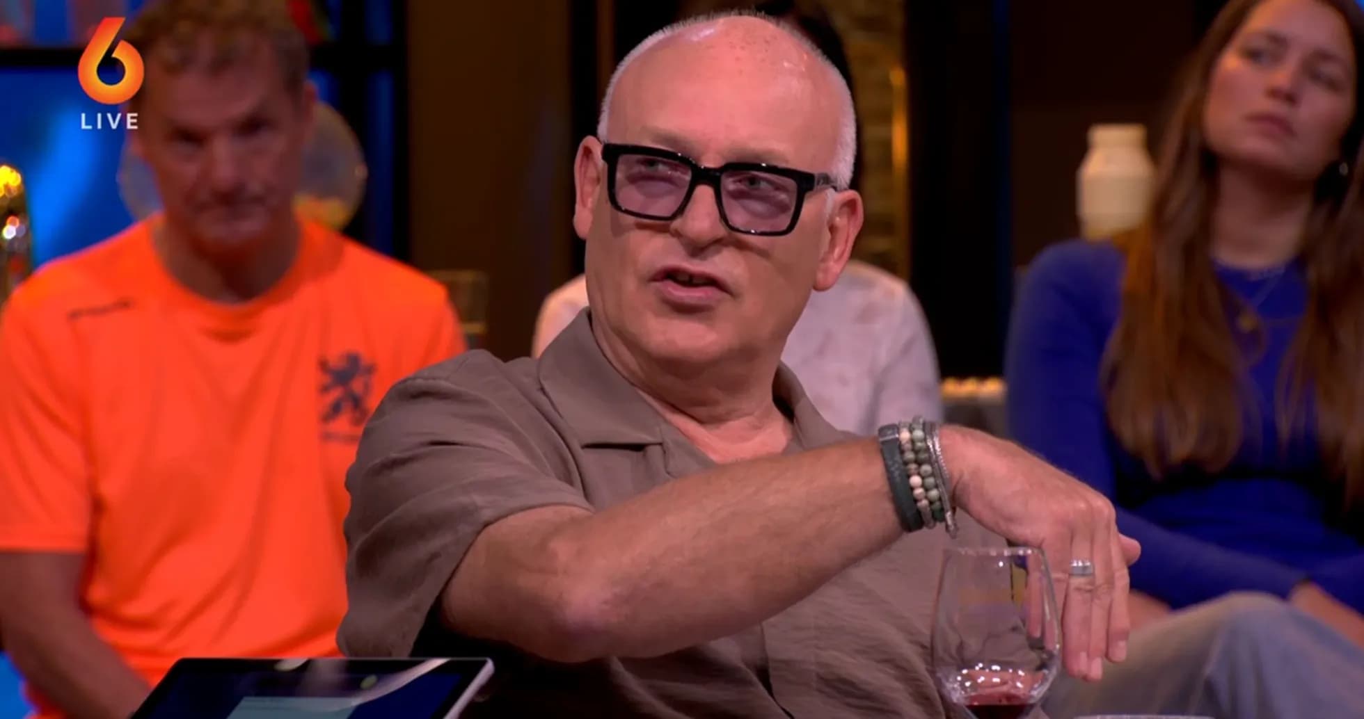 Man speaking during a talk show with audience