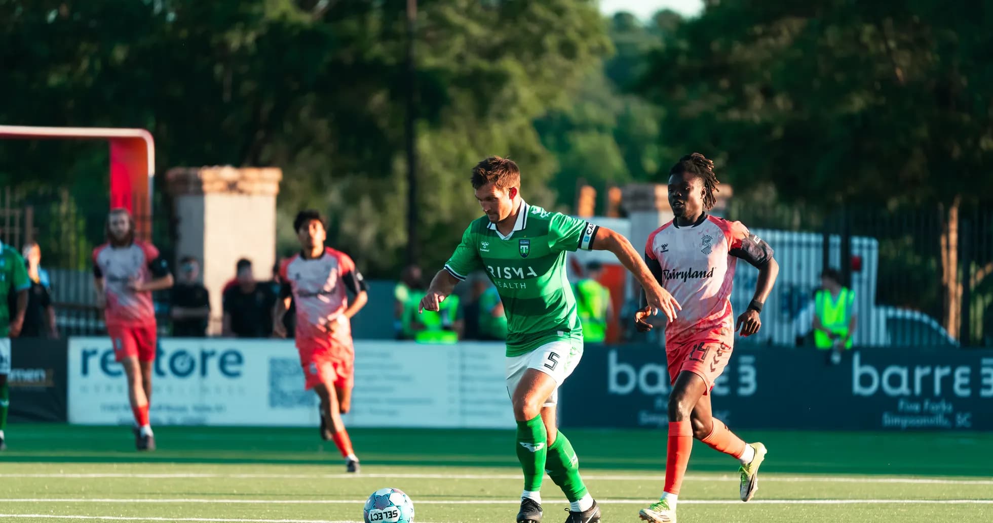Player dribbling the ball during football match