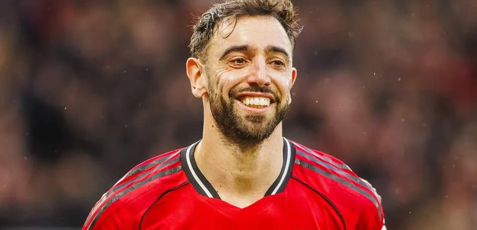 Player smiling in Manchester United red jersey