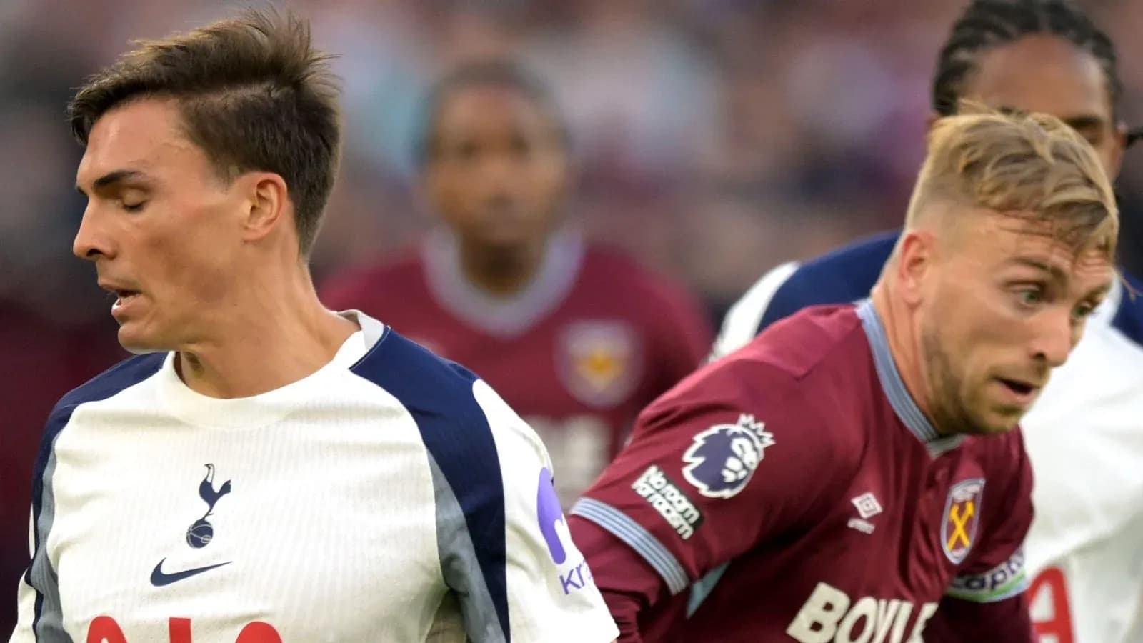 Two players from Tottenham and West Ham in action