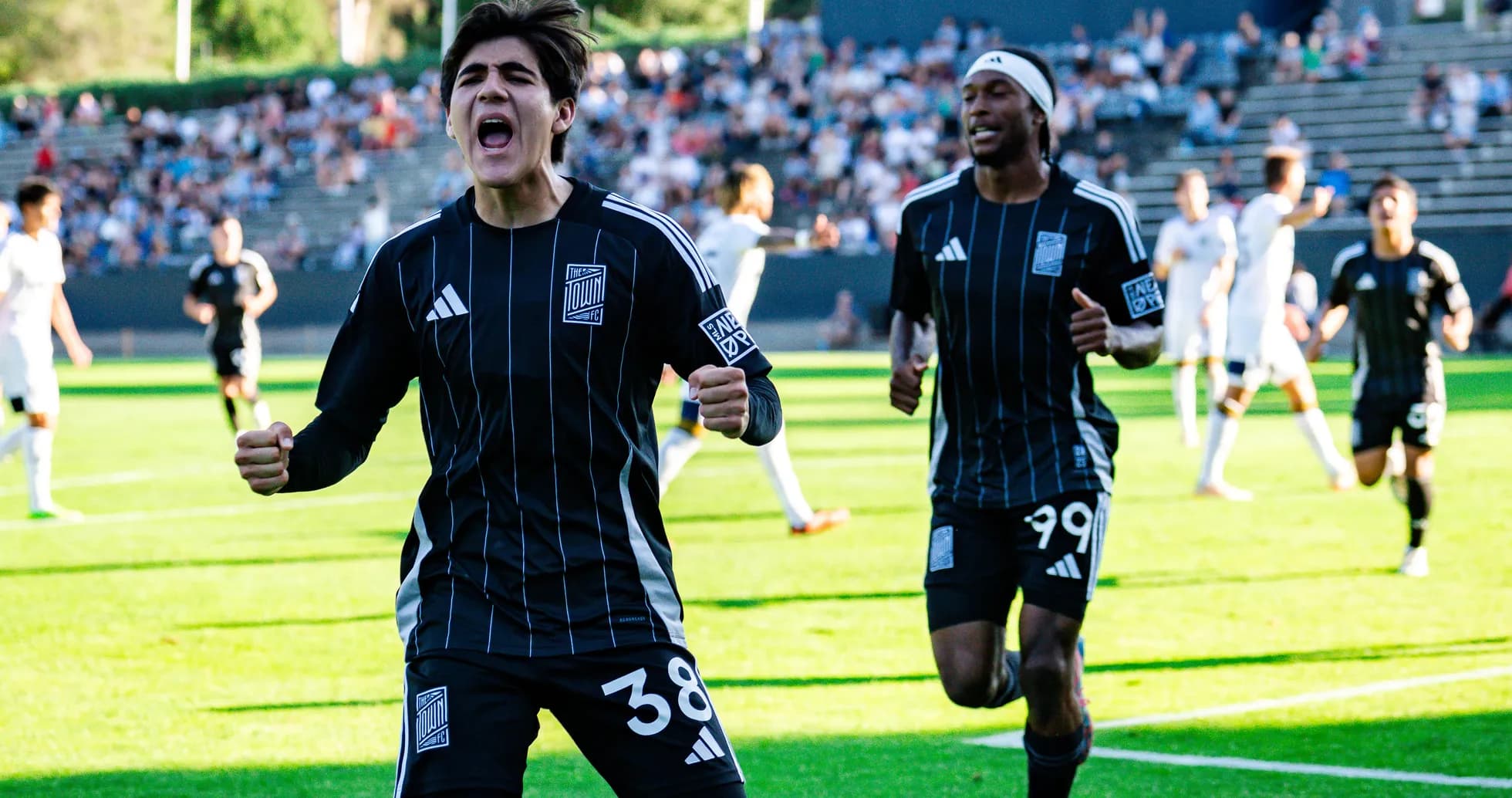 Players celebrating a goal during Town match