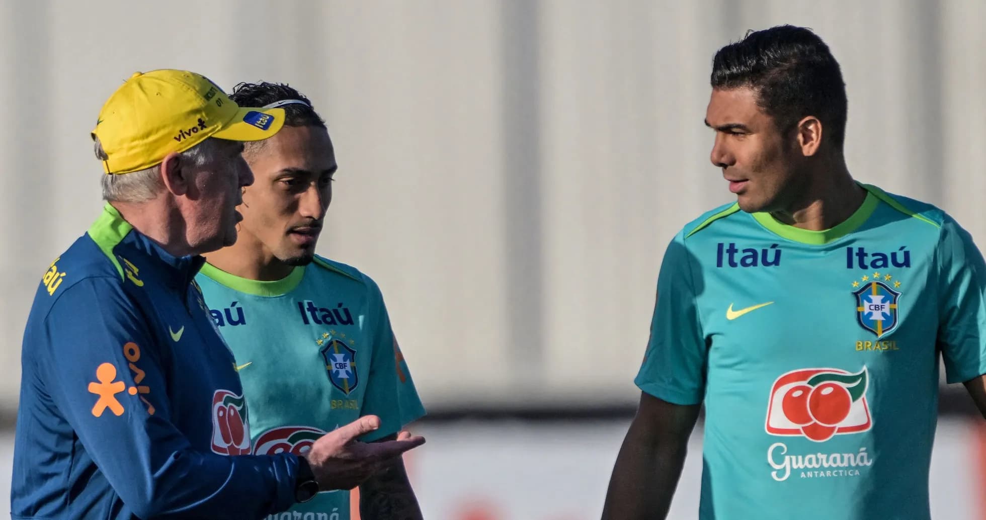 Brazilian coach discussing with players during training