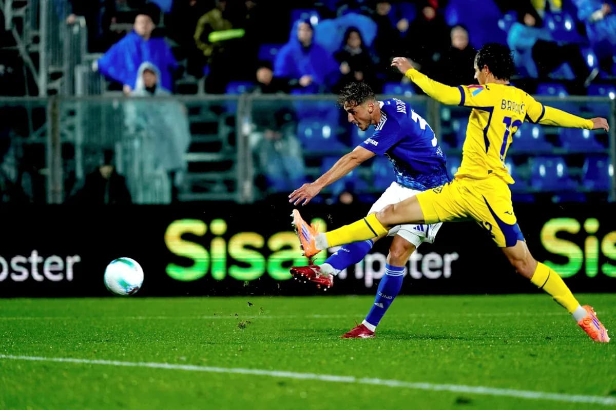 Player striking the ball during Hellas Verona match