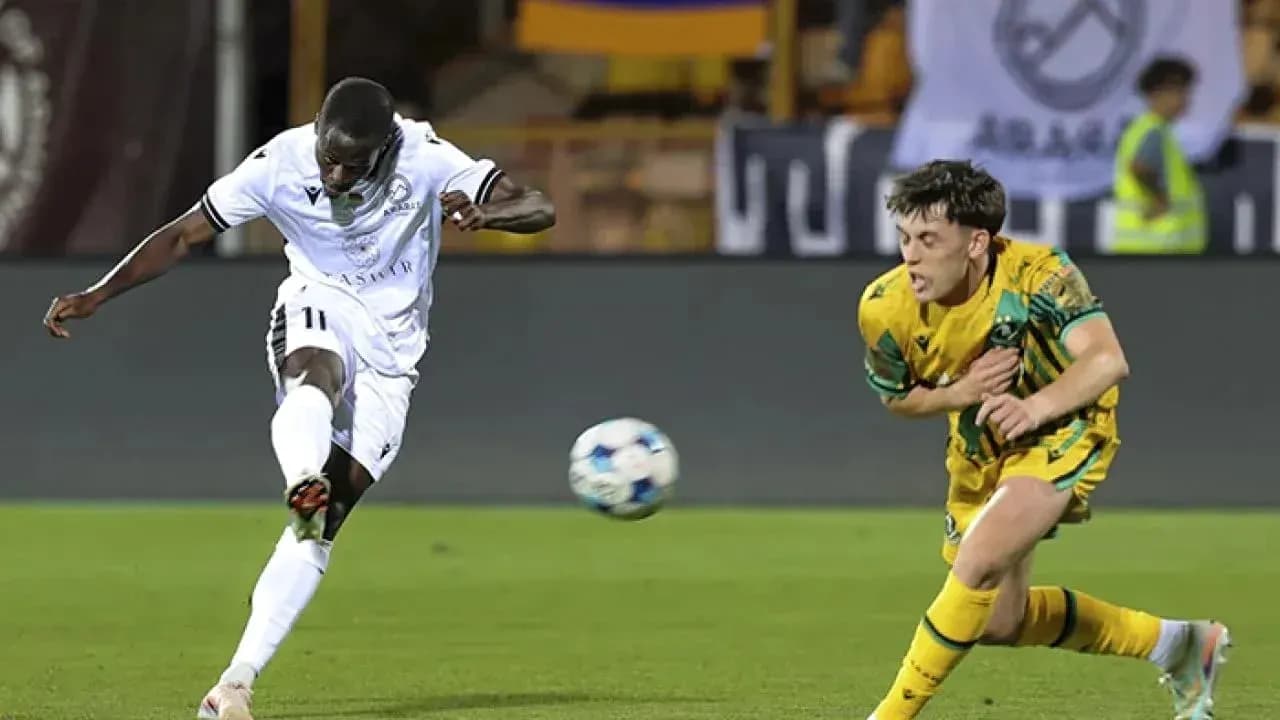 Player kicking ball during UEFA Champions League match