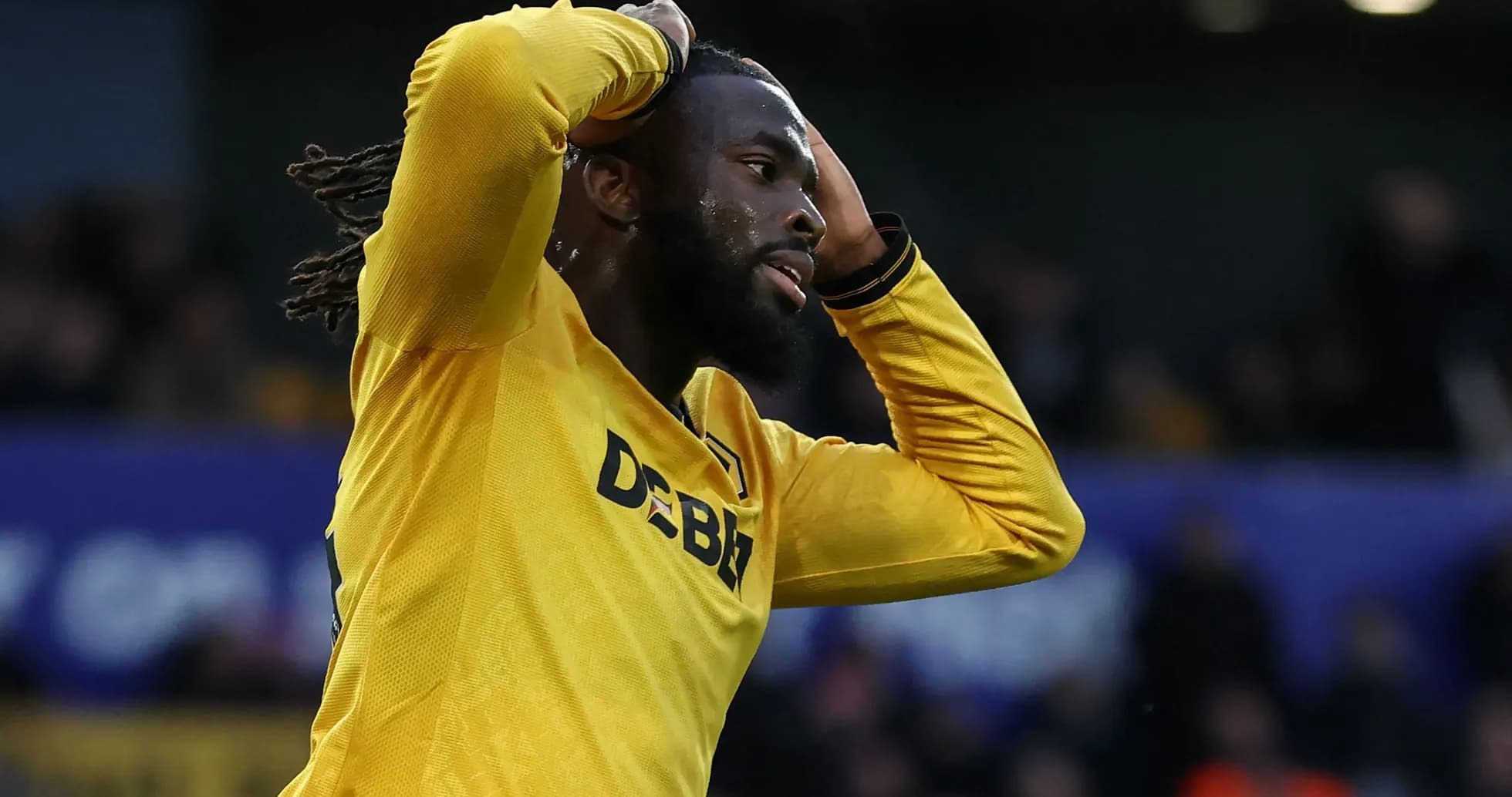 Player in yellow jersey reacting during match