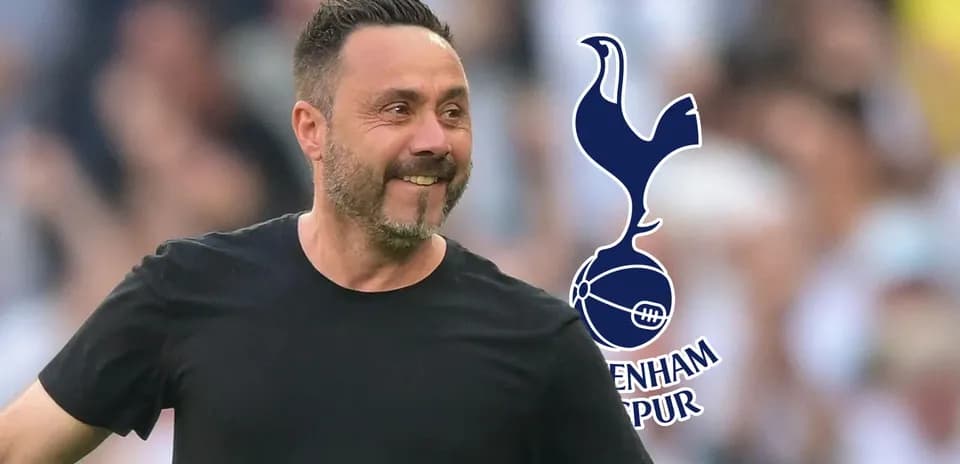 Manager celebrating during match with Tottenham Hotspur logo