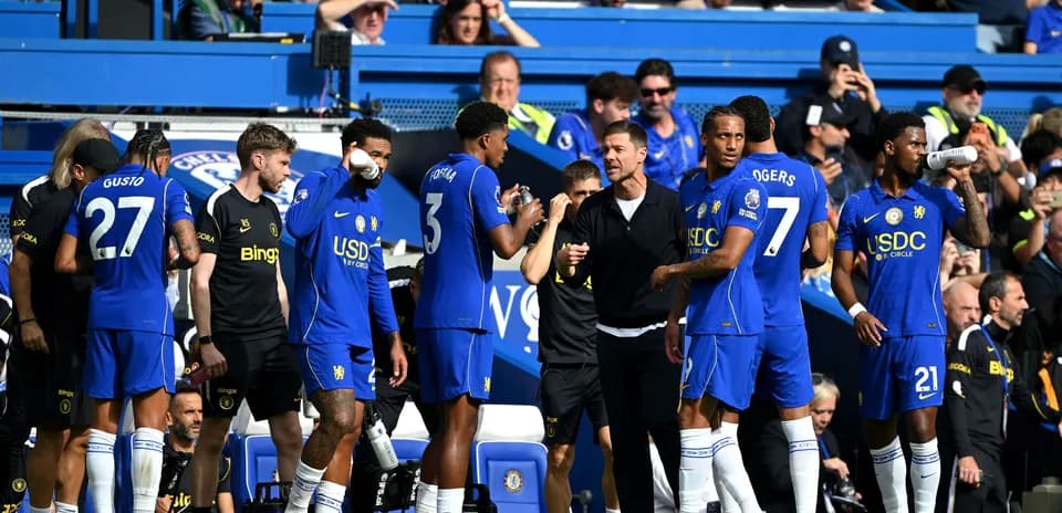 Chelsea players preparing on the sidelines during match