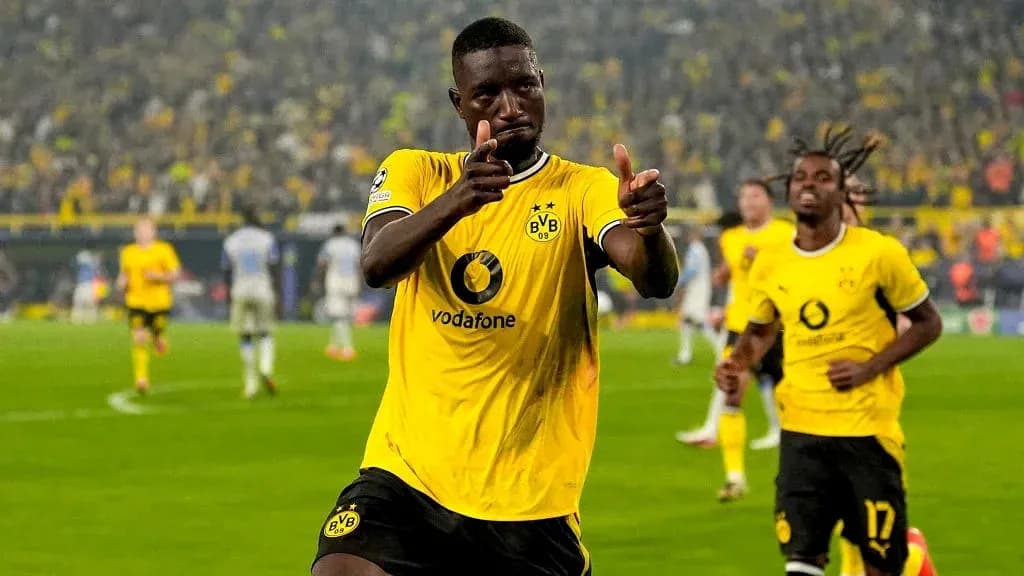 Player celebrating goal in Borussia Dortmund jersey