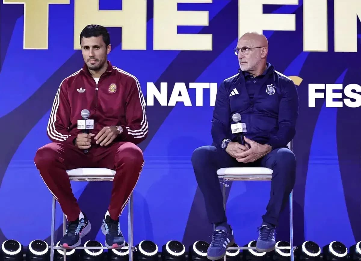 Two coaches seated at a press conference