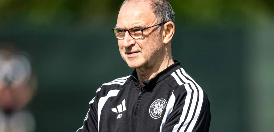 Coach observing players during training session
