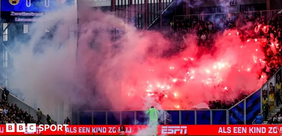 Fans celebrating with flares during a match