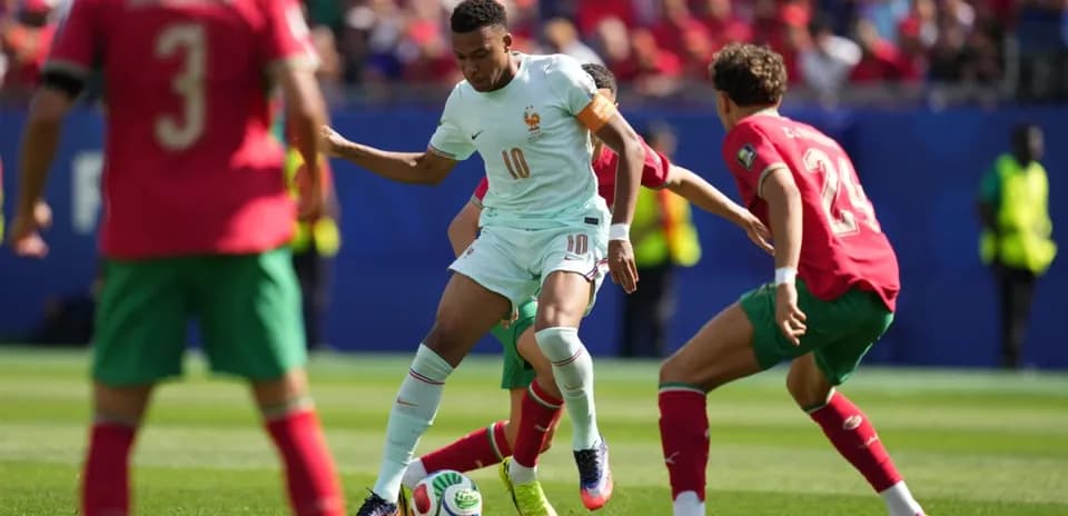 Player dribbling past defenders during football match