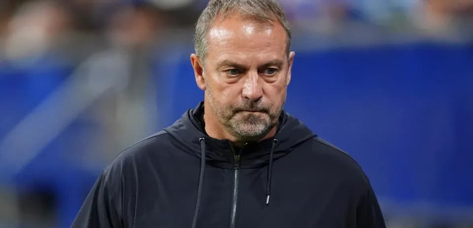 Coach observing the match from the sidelines