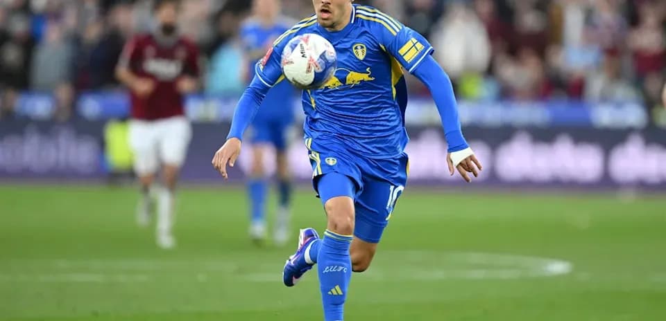 Player in blue kit controlling the ball during match