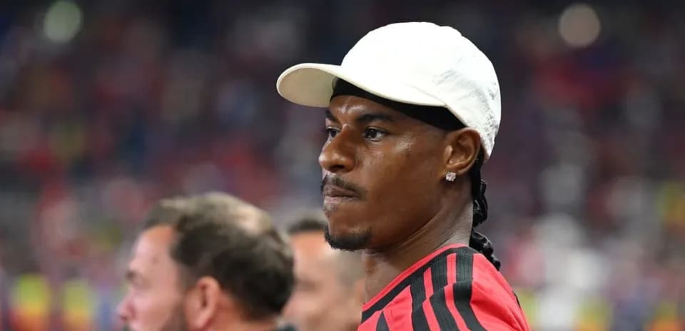 Player wearing white cap during match observation