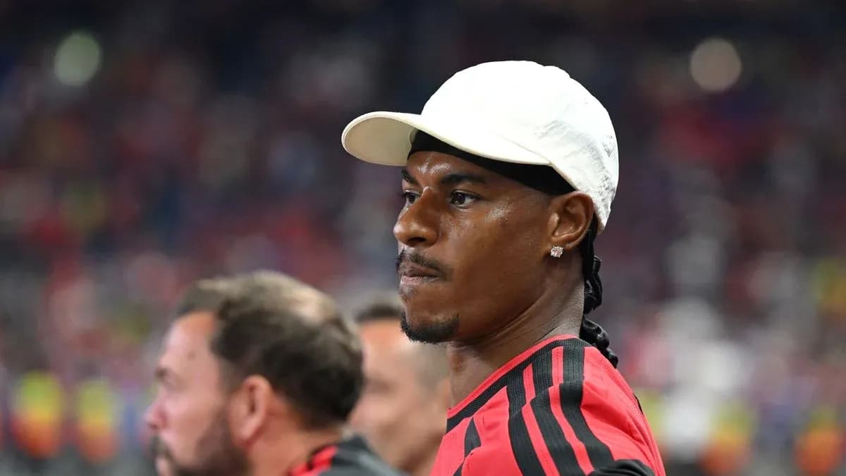 Player wearing white cap during match observation