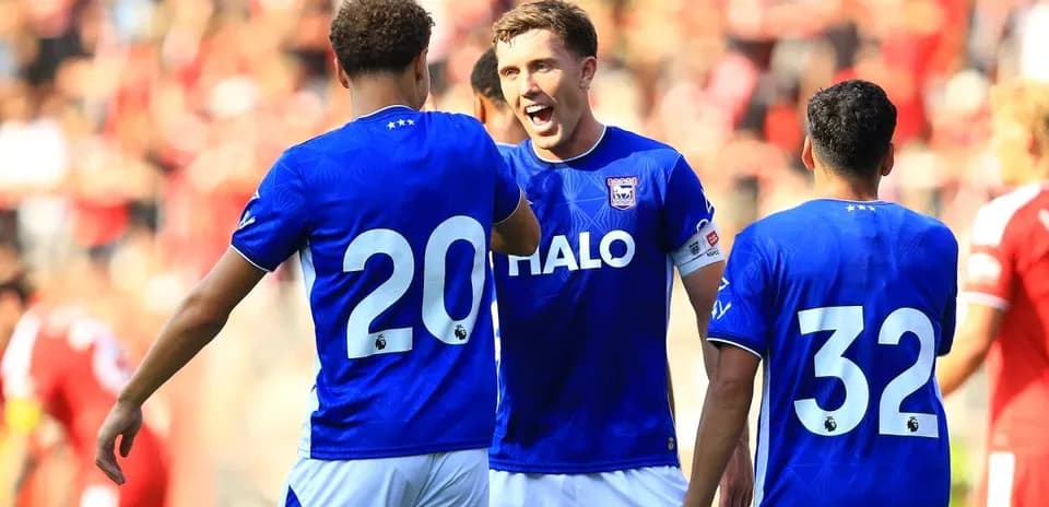 Players celebrating a goal during a match