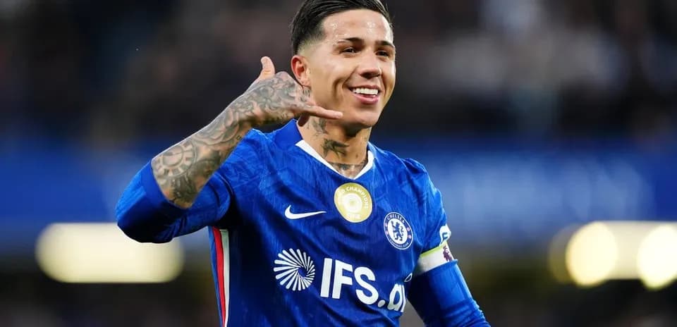 Chelsea player celebrating with hand gesture on pitch