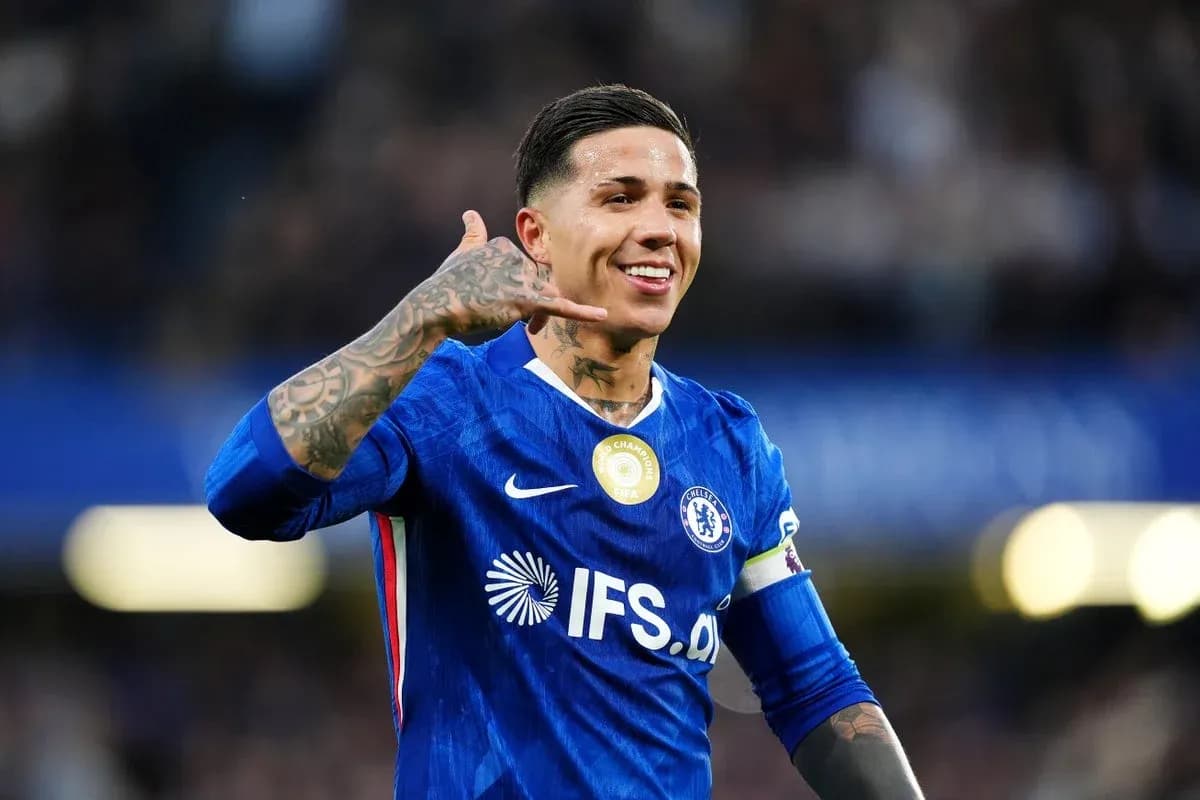 Chelsea player celebrating with hand gesture on pitch