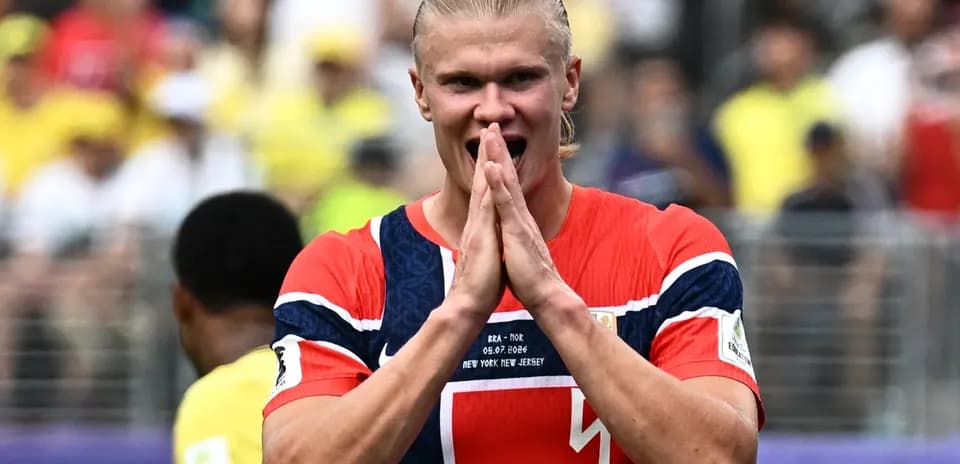 Player celebrating during match with fans in background