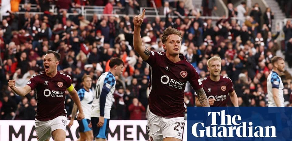 Hearts player celebrating a goal with teammates