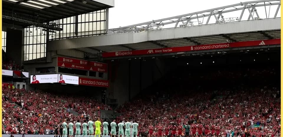Teams lined up for a tribute at Anfield stadium