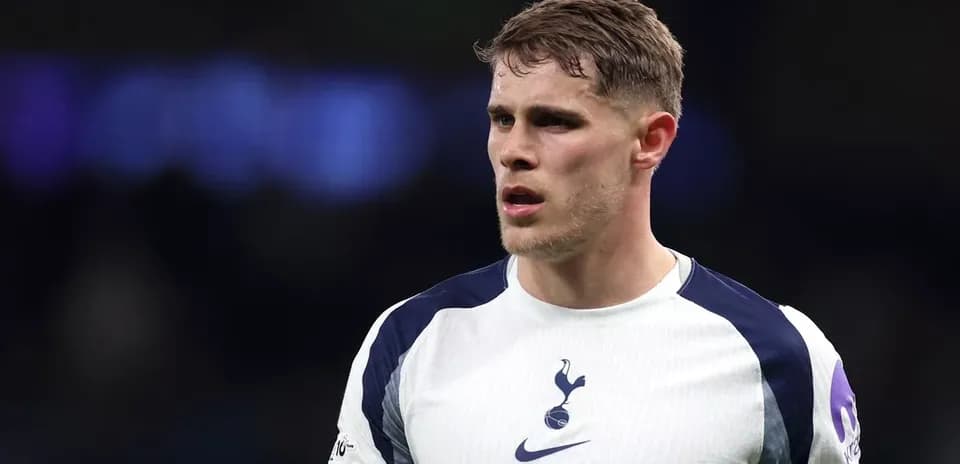 Player wearing Tottenham Hotspur jersey on field