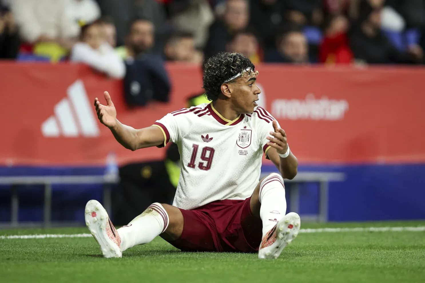 Player from Spain sitting on the pitch