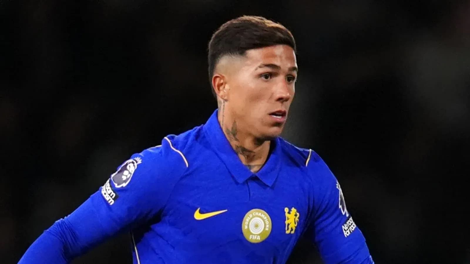 Player in blue kit running during match