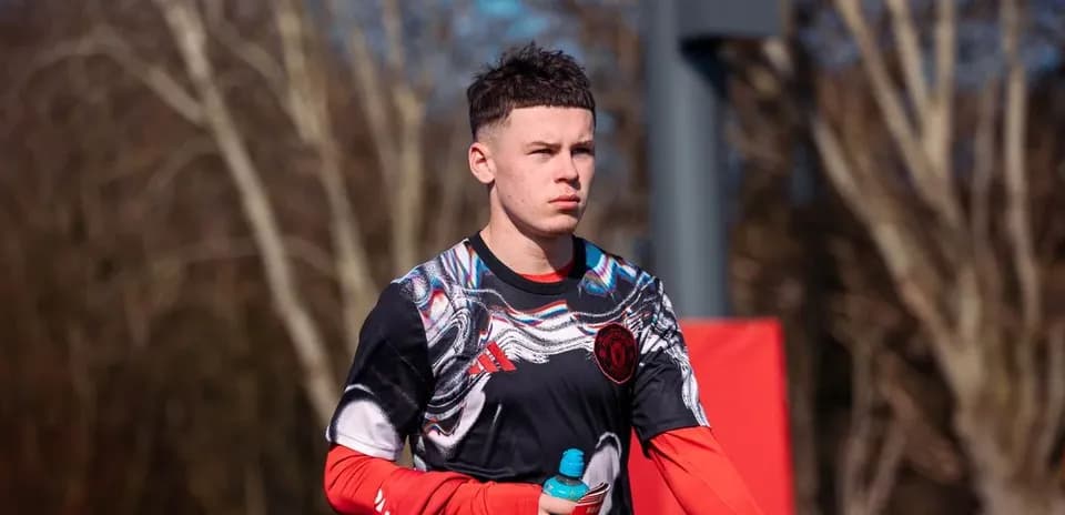 Player walking with a water bottle during training