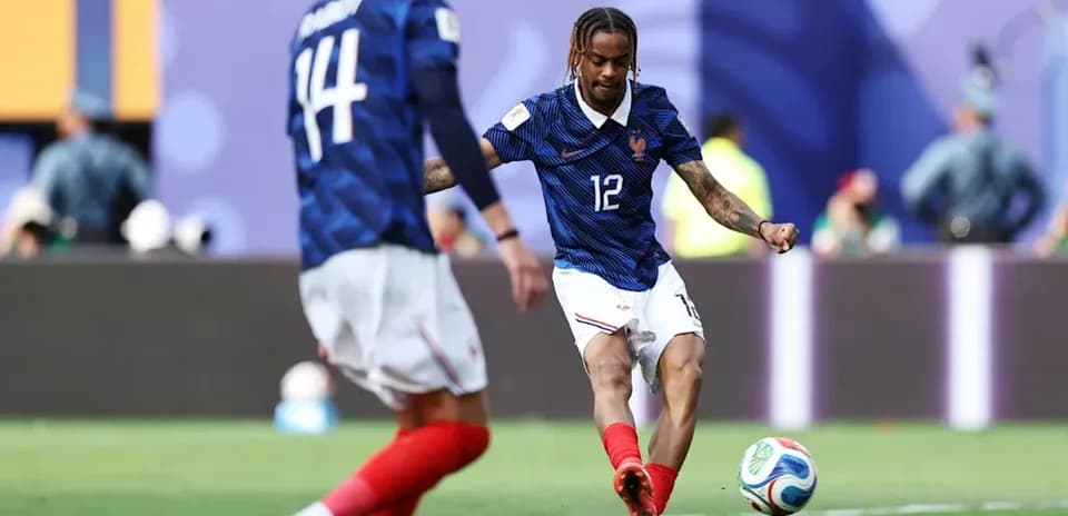 French player kicking ball during match action