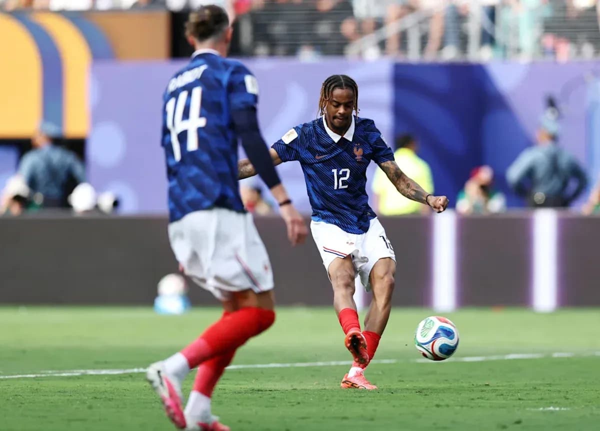 French player kicking ball during match action