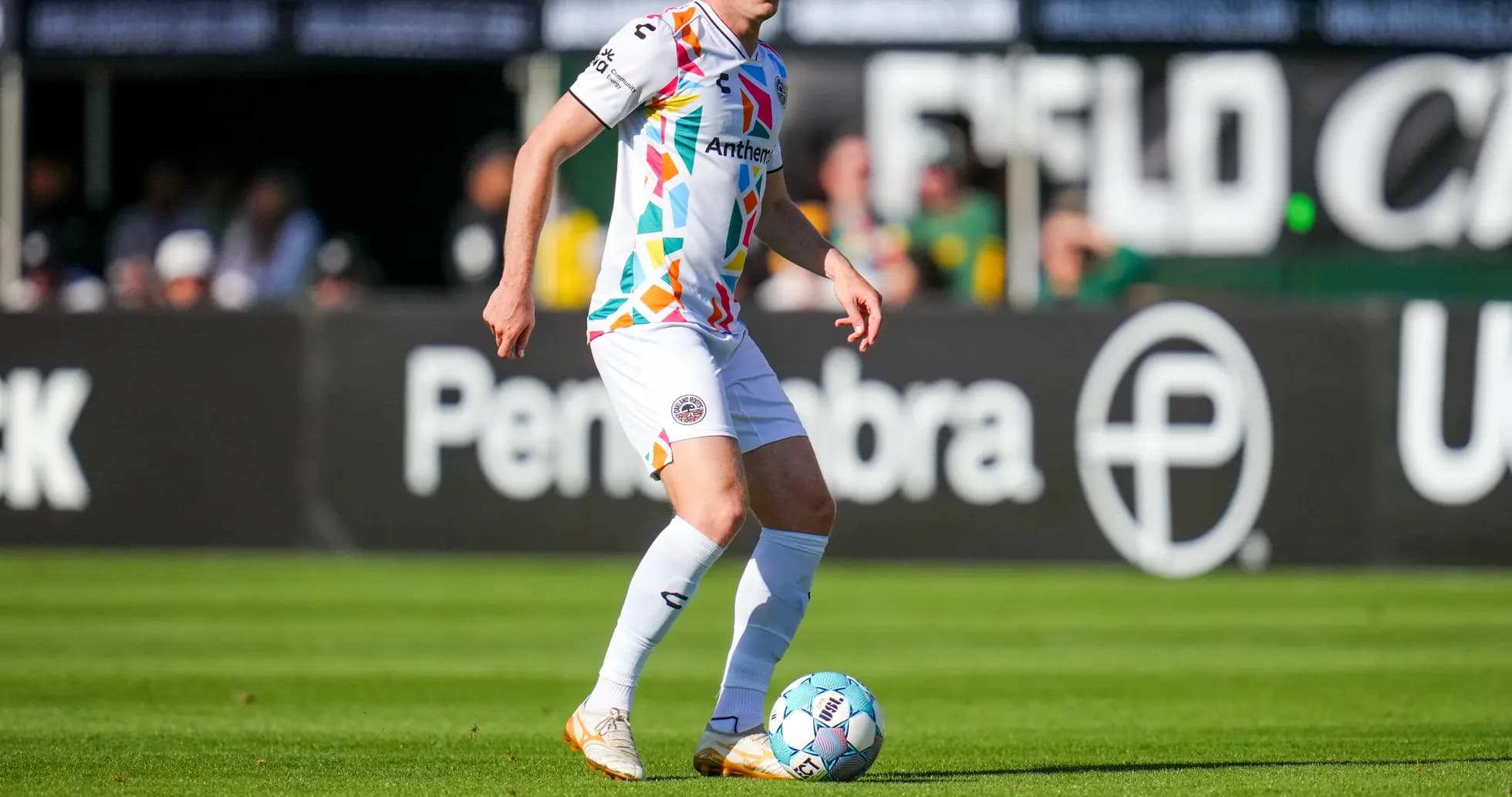 Player dribbling ball during USL Championship match