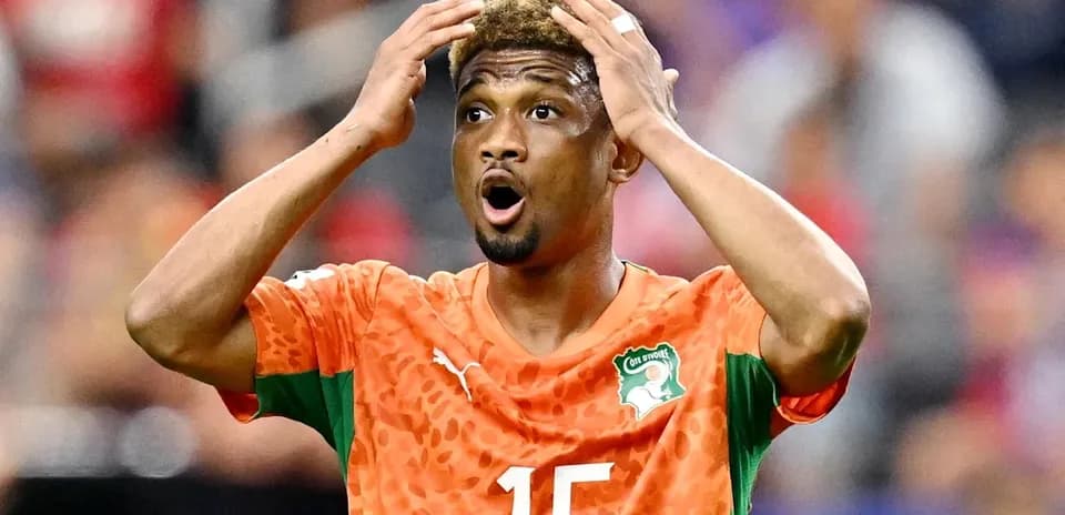 Player in orange jersey reacting during match