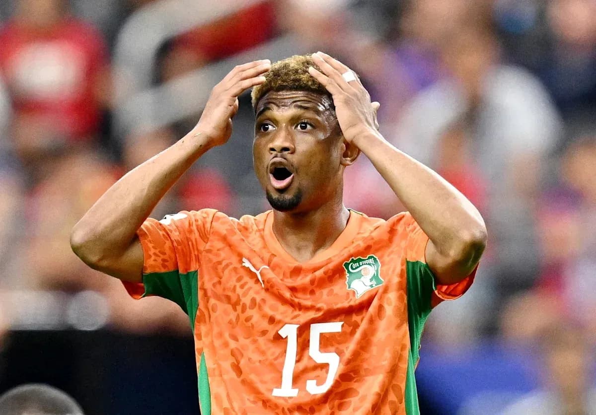 Player in orange jersey reacting during match