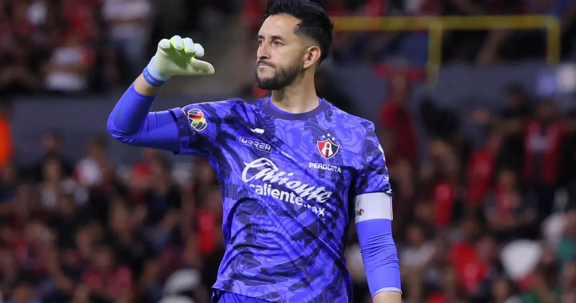 Goalkeeper celebrating during Liga MX match