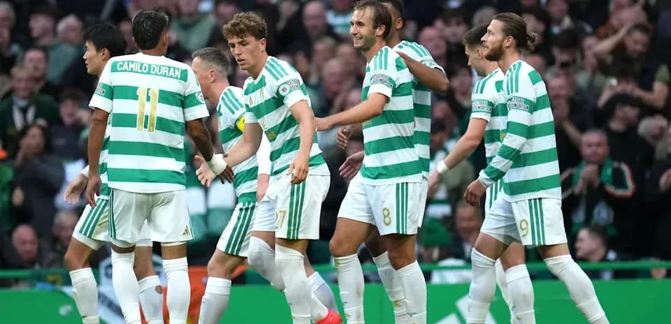 Celtic players celebrating a goal on the pitch