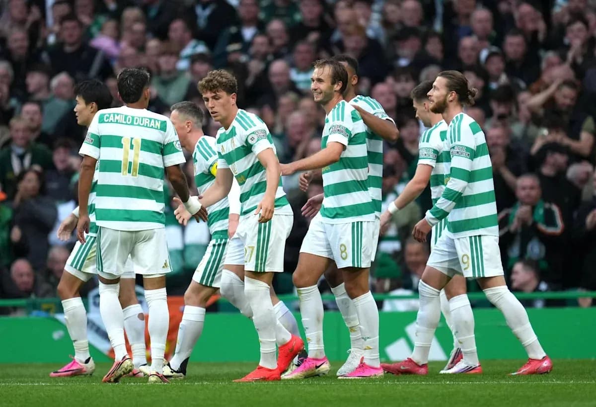 Celtic players celebrating a goal on the pitch