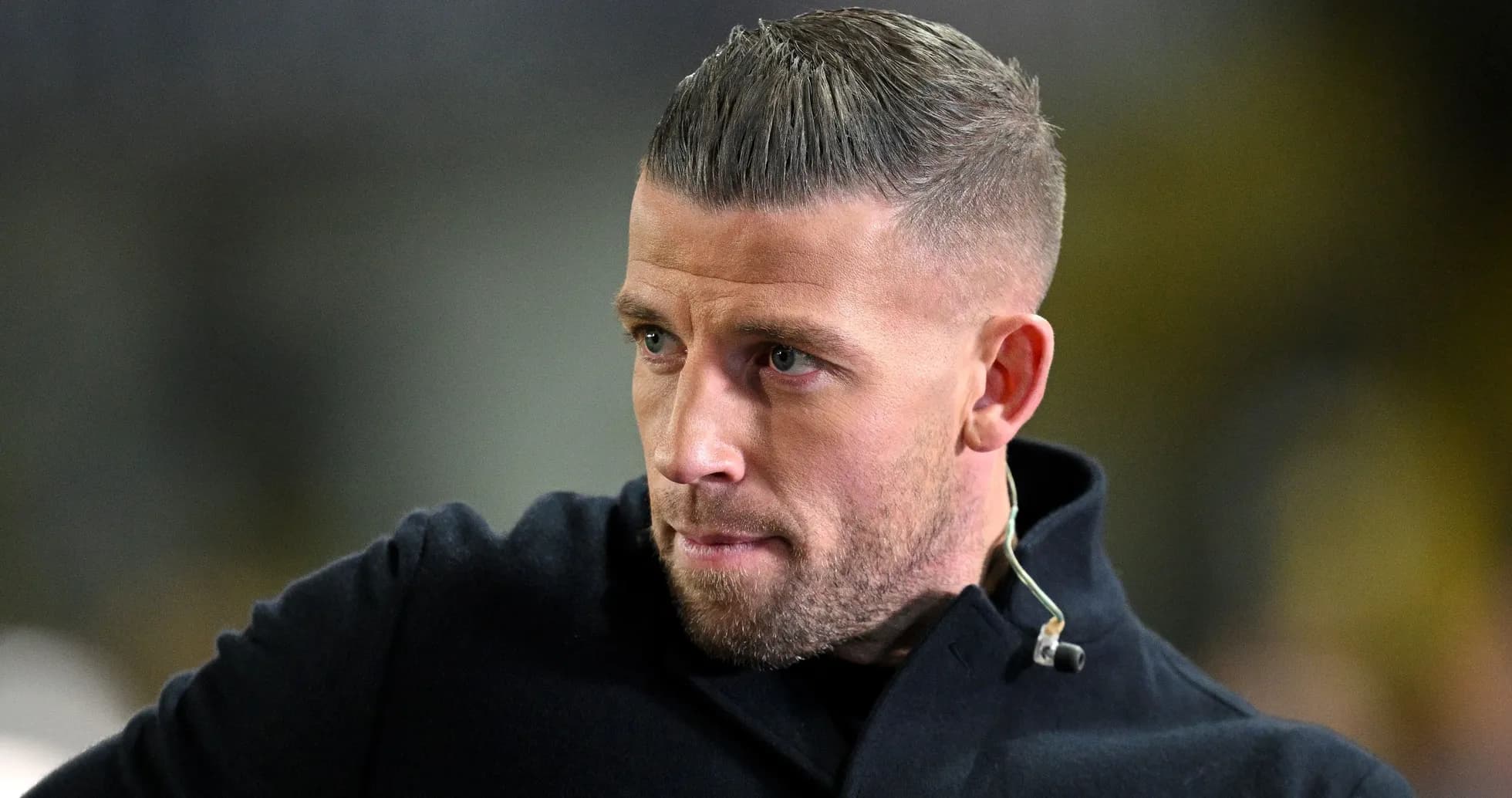 Close-up of a man with short hair in jacket