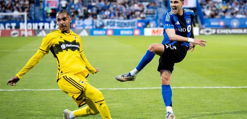 Player kicking the ball during match action