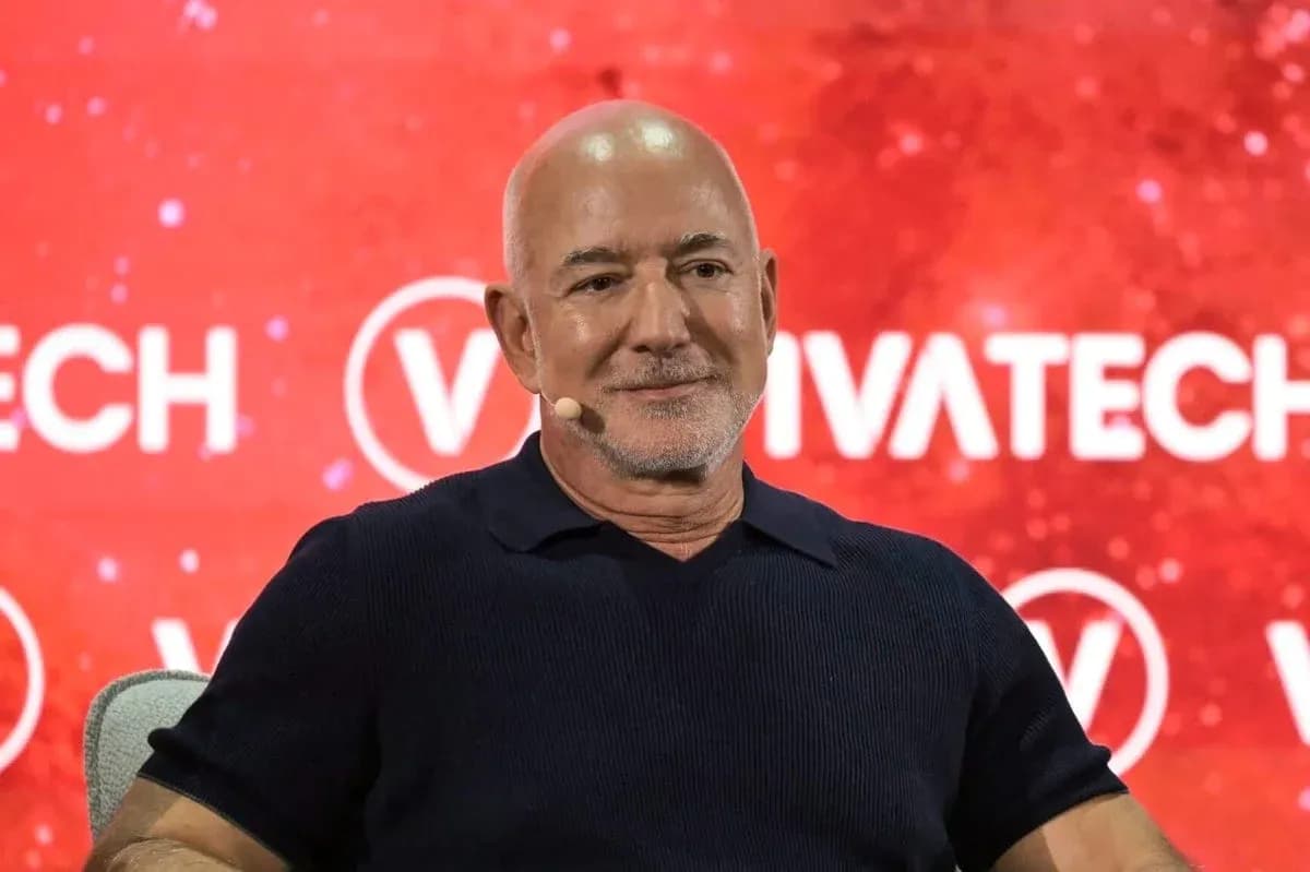 Speaker at VivaTech event with red background